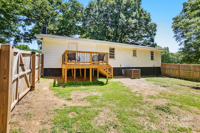 2903 Price Rushing Rd, Monroe, NC 28110 - rear view of property featuring a deck, a fenced backyard, a chimney, central AC, and stairs