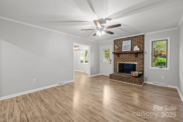 13446 Idlefield Ln, Matthews, NC 28105 - unfurnished living room with crown molding, ceiling fan, baseboards, wood finished floors, and a fireplace