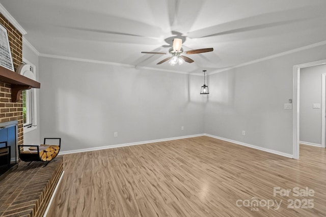 13446 Idlefield Ln, Matthews, NC 28105 - unfurnished living room featuring a ceiling fan, light wood-type flooring, crown molding, and baseboards