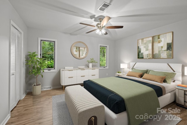 13446 Idlefield Ln, Matthews, NC 28105 - bedroom with baseboards, wood finished floors, and a ceiling fan