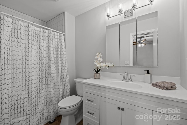 13446 Idlefield Ln, Matthews, NC 28105 - full bathroom featuring toilet, vanity, a ceiling fan, and a shower with curtain