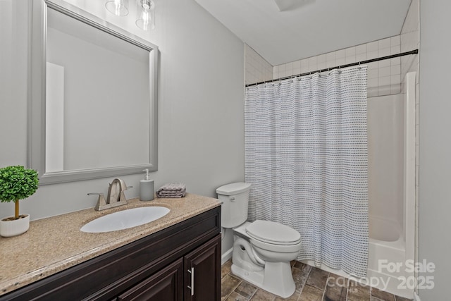 13446 Idlefield Ln, Matthews, NC 28105 - full bathroom with vanity, toilet, stone finish floors, and shower / tub combo