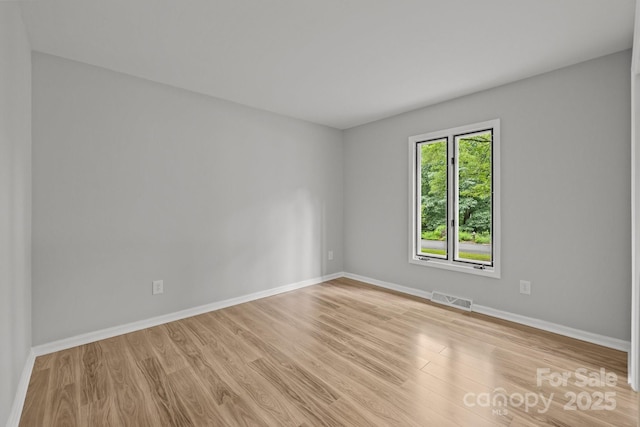 13446 Idlefield Ln, Matthews, NC 28105 - empty room featuring light wood-style floors and baseboards