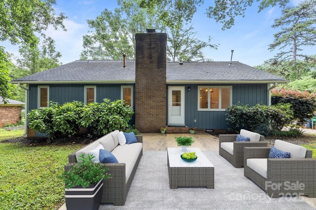 13446 Idlefield Ln, Matthews, NC 28105 - back of house with a chimney, an outdoor hangout area, roof with shingles, and a patio area