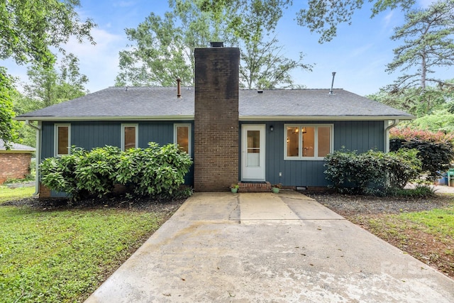 13446 Idlefield Ln, Matthews, NC 28105 - view of front of property with a chimney and a shingled roof