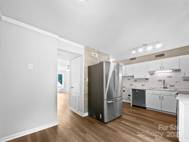 1908 Harvest Ln Unit 5, Charlotte, NC 28210 - kitchen featuring stainless steel appliances, a sink, light countertops, dark wood-style floors, and white cabinets