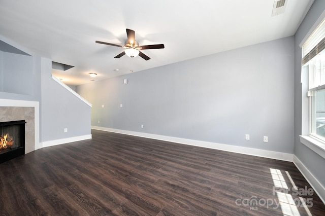 207 Stoney Point Way, Candler, NC 28715 - unfurnished living room with ceiling fan, dark wood-style flooring, a fireplace, and baseboards