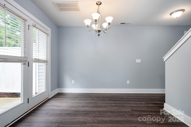207 Stoney Point Way, Candler, NC 28715 - unfurnished room with a chandelier, dark wood finished floors, and baseboards