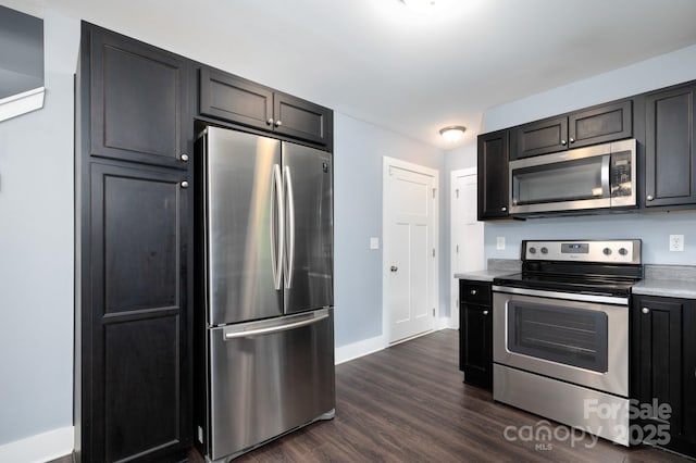 207 Stoney Point Way, Candler, NC 28715 - kitchen featuring appliances with stainless steel finishes, dark wood-style flooring, baseboards, and light countertops