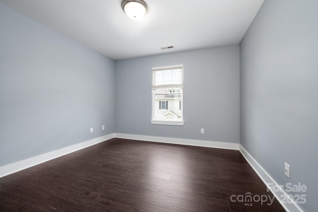 207 Stoney Point Way, Candler, NC 28715 - spare room with baseboards and dark wood finished floors
