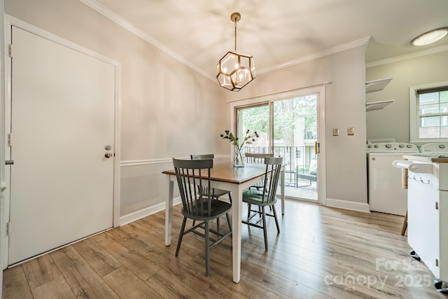 5927 Quail Hollow Rd Unit H, Charlotte, NC 28210 - dining room with washer and clothes dryer, crown molding, light wood-type flooring, plenty of natural light, and a chandelier