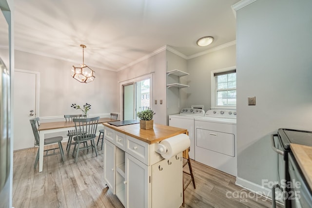 5927 Quail Hollow Rd Unit H, Charlotte, NC 28210 - kitchen featuring separate washer and dryer, open shelves, white cabinetry, light wood finished floors, and electric stove