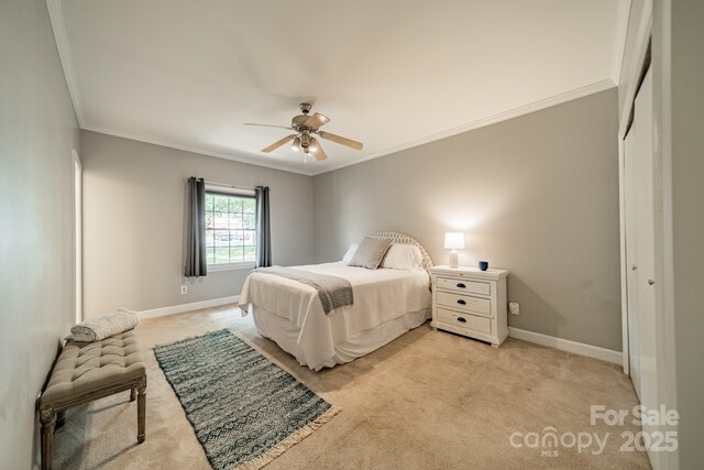 5927 Quail Hollow Rd Unit H, Charlotte, NC 28210 - bedroom with ornamental molding, light carpet, baseboards, a closet, and ceiling fan