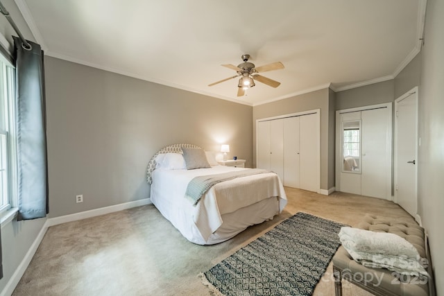 5927 Quail Hollow Rd Unit H, Charlotte, NC 28210 - bedroom featuring light colored carpet, ornamental molding, baseboards, a ceiling fan, and multiple closets