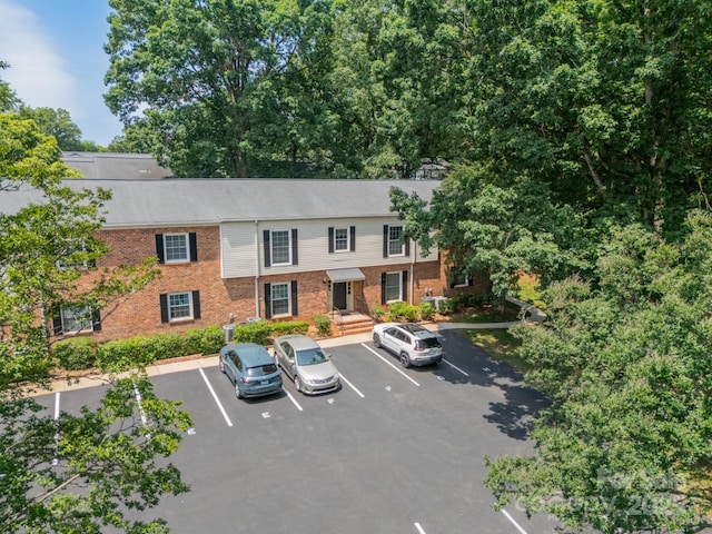 5927 Quail Hollow Rd Unit H, Charlotte, NC 28210 - view of building exterior featuring uncovered parking