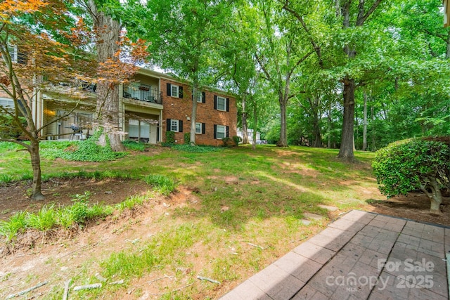 5927 Quail Hollow Rd Unit H, Charlotte, NC 28210 - view of grassy yard with a balcony