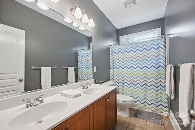 12900 Westmoreland Rd, Huntersville, NC 28078 - full bath with toilet, double vanity, tile patterned floors, and a shower with curtain