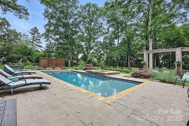 12900 Westmoreland Rd, Huntersville, NC 28078 - view of swimming pool with a patio, a pool with connected hot tub, and view of wooded area