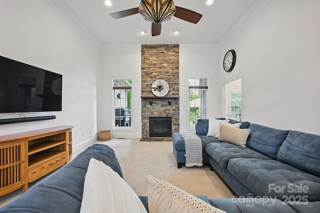 12900 Westmoreland Rd, Huntersville, NC 28078 - living room featuring crown molding, plenty of natural light, ceiling fan, a fireplace, and carpet floors