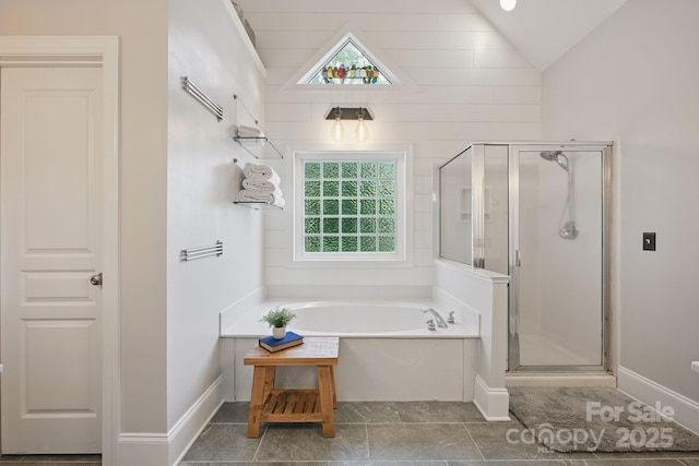 12900 Westmoreland Rd, Huntersville, NC 28078 - full bathroom with a garden tub, a shower stall, vaulted ceiling, and baseboards