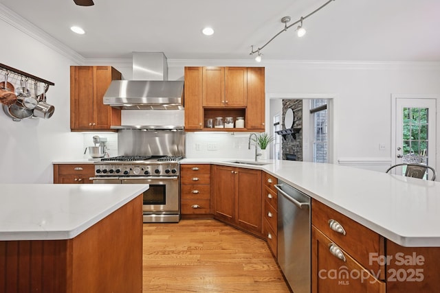 12900 Westmoreland Rd, Huntersville, NC 28078 - kitchen featuring wall chimney exhaust hood, stainless steel appliances, a sink, a peninsula, and light countertops