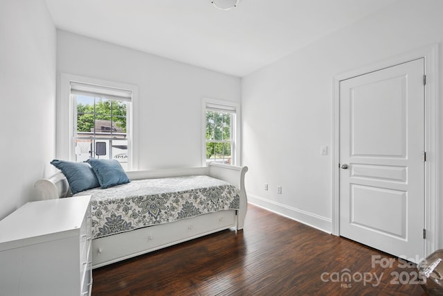 12900 Westmoreland Rd, Huntersville, NC 28078 - bedroom featuring multiple windows, dark wood finished floors, and baseboards