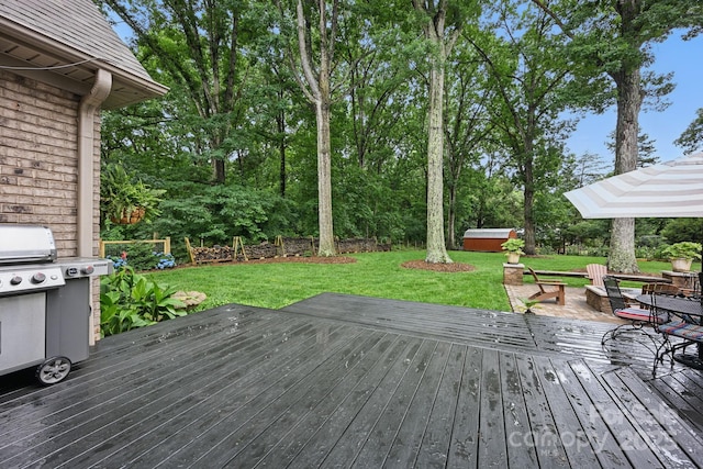 12900 Westmoreland Rd, Huntersville, NC 28078 - wooden terrace with a yard, view of wooded area, and a grill