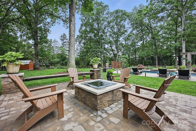 12900 Westmoreland Rd, Huntersville, NC 28078 - view of patio / terrace featuring a fire pit and view of scattered trees