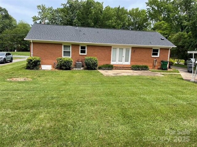 5734 Brookhaven Rd, Charlotte, NC 28210 - rear view of property with brick siding, french doors, and a yard