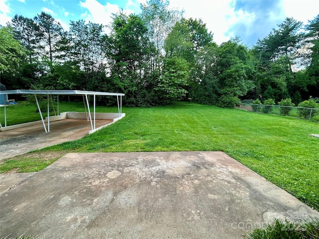 5734 Brookhaven Rd, Charlotte, NC 28210 - view of green lawn featuring a carport
