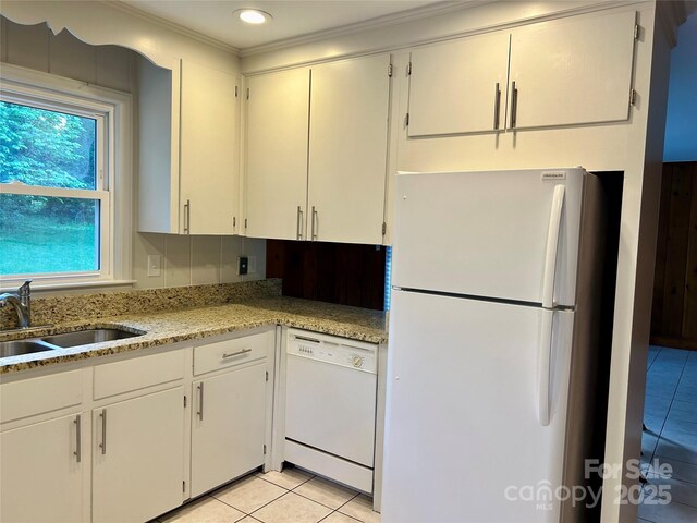 5734 Brookhaven Rd, Charlotte, NC 28210 - kitchen featuring white appliances, a sink, light tile patterned floors, white cabinets, and crown molding