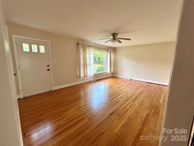 5734 Brookhaven Rd, Charlotte, NC 28210 - spare room featuring wood finished floors, a ceiling fan, and baseboards