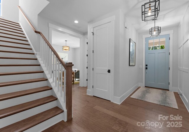 4021 Redwood Ave, Charlotte, NC 28205 - foyer with stairway, wood finished floors, recessed lighting, and baseboards