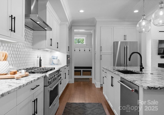 4021 Redwood Ave, Charlotte, NC 28205 - kitchen featuring wall chimney exhaust hood, high quality appliances, a sink, dark wood-style flooring, and white cabinets