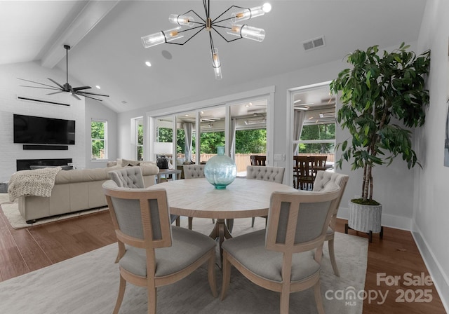 4021 Redwood Ave, Charlotte, NC 28205 - dining room with wood finished floors, healthy amount of natural light, a chandelier, and ceiling fan