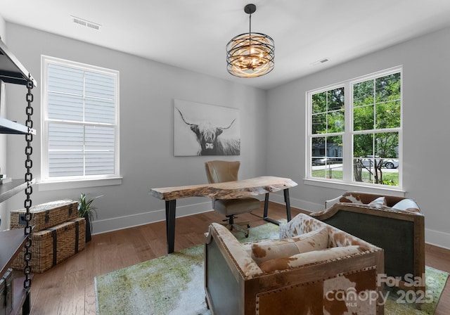 4021 Redwood Ave, Charlotte, NC 28205 - home office featuring a chandelier, baseboards, and wood finished floors