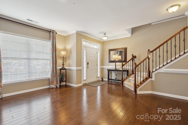 4430 Bravery Pl SW, Concord, NC 28027 - foyer entrance featuring stairway, baseboards, wood finished floors, and ornamental molding