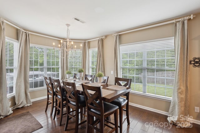 4430 Bravery Pl SW, Concord, NC 28027 - dining area with a chandelier, dark wood-style flooring, baseboards, and plenty of natural light