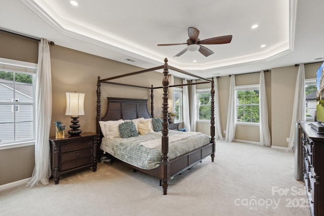 4430 Bravery Pl SW, Concord, NC 28027 - bedroom featuring a raised ceiling, light colored carpet, baseboards, recessed lighting, and a ceiling fan