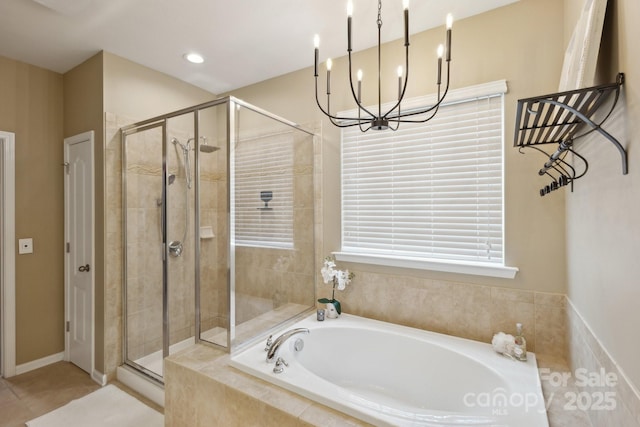 4430 Bravery Pl SW, Concord, NC 28027 - bathroom featuring a shower stall, a bath, a chandelier, and tile patterned floors