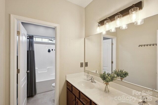 4430 Bravery Pl SW, Concord, NC 28027 - bathroom with toilet, double vanity, tile patterned floors, and shower / tub combination