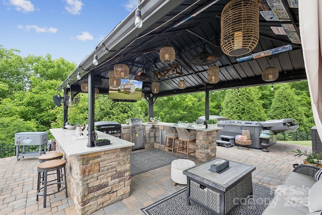 4430 Bravery Pl SW, Concord, NC 28027 - view of patio / terrace with an outdoor kitchen and a gazebo