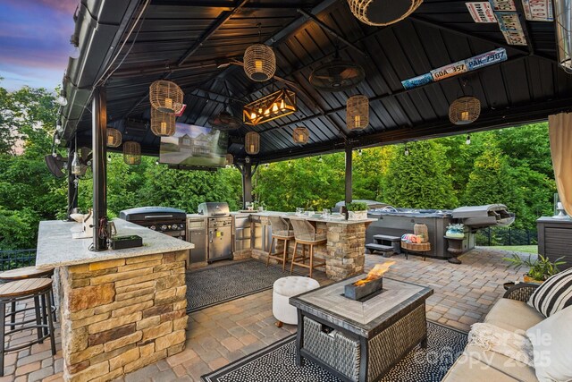 4430 Bravery Pl SW, Concord, NC 28027 - view of patio / terrace featuring an outdoor fire pit and a gazebo