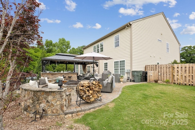 4430 Bravery Pl SW, Concord, NC 28027 - back of property with a gazebo, a patio, and outdoor lounge area
