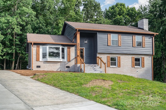 300 Dollar Cir, Charlotte, NC 28270 - tri-level home with a chimney, a front lawn, brick siding, and crawl space