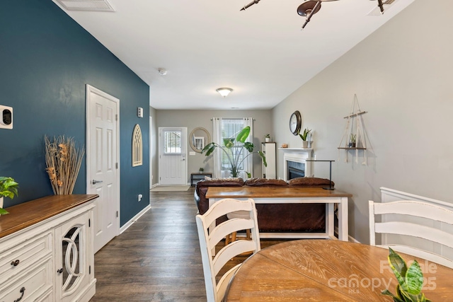 20 Daphne Dr, Arden, NC 28704 - dining area featuring dark wood-type flooring, a fireplace, and baseboards