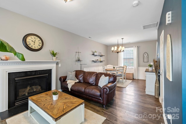 20 Daphne Dr, Arden, NC 28704 - living room featuring a chandelier, dark wood-style flooring, and a glass covered fireplace