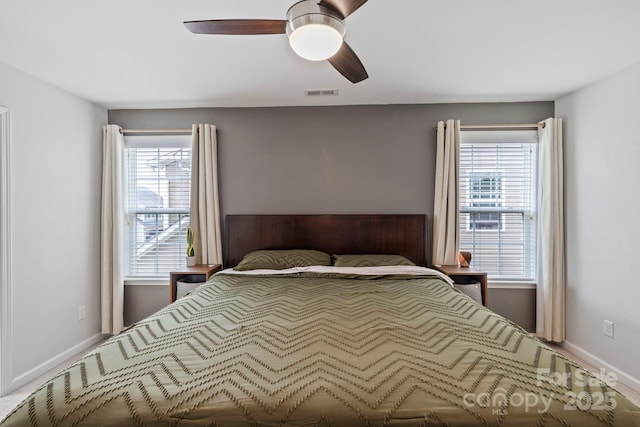 20 Daphne Dr, Arden, NC 28704 - bedroom with multiple windows, baseboards, and ceiling fan