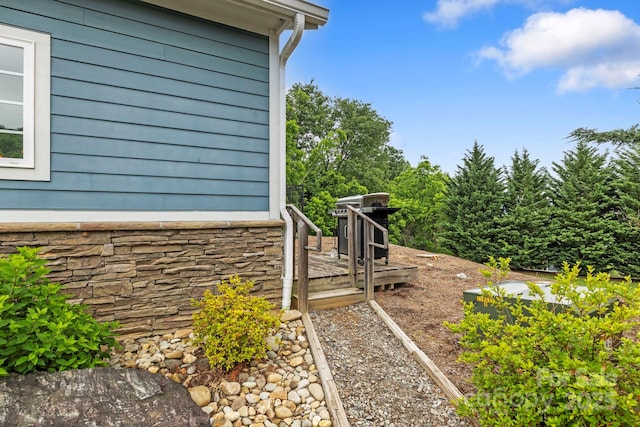 20 Daphne Dr, Arden, NC 28704 - view of side of property featuring stone siding and a wooden deck