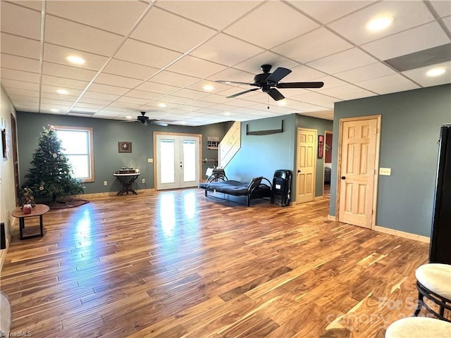 658 Green Point Ln, Boomer, NC 28606 - living room featuring a ceiling fan, wood finished floors, a drop ceiling, french doors, and recessed lighting